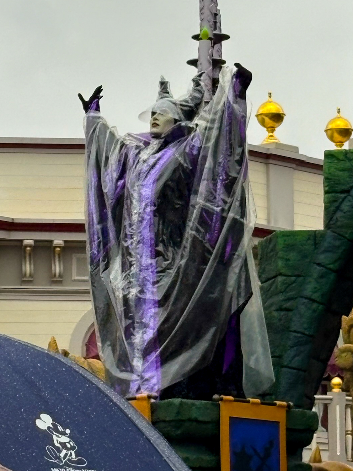 Maleficent in rain coat
